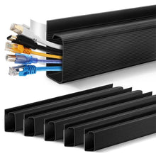 Black cable management strip with bundled cables on a white background